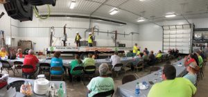 Employees performing a safety demonstration for Kankakee Valley REMC safety day