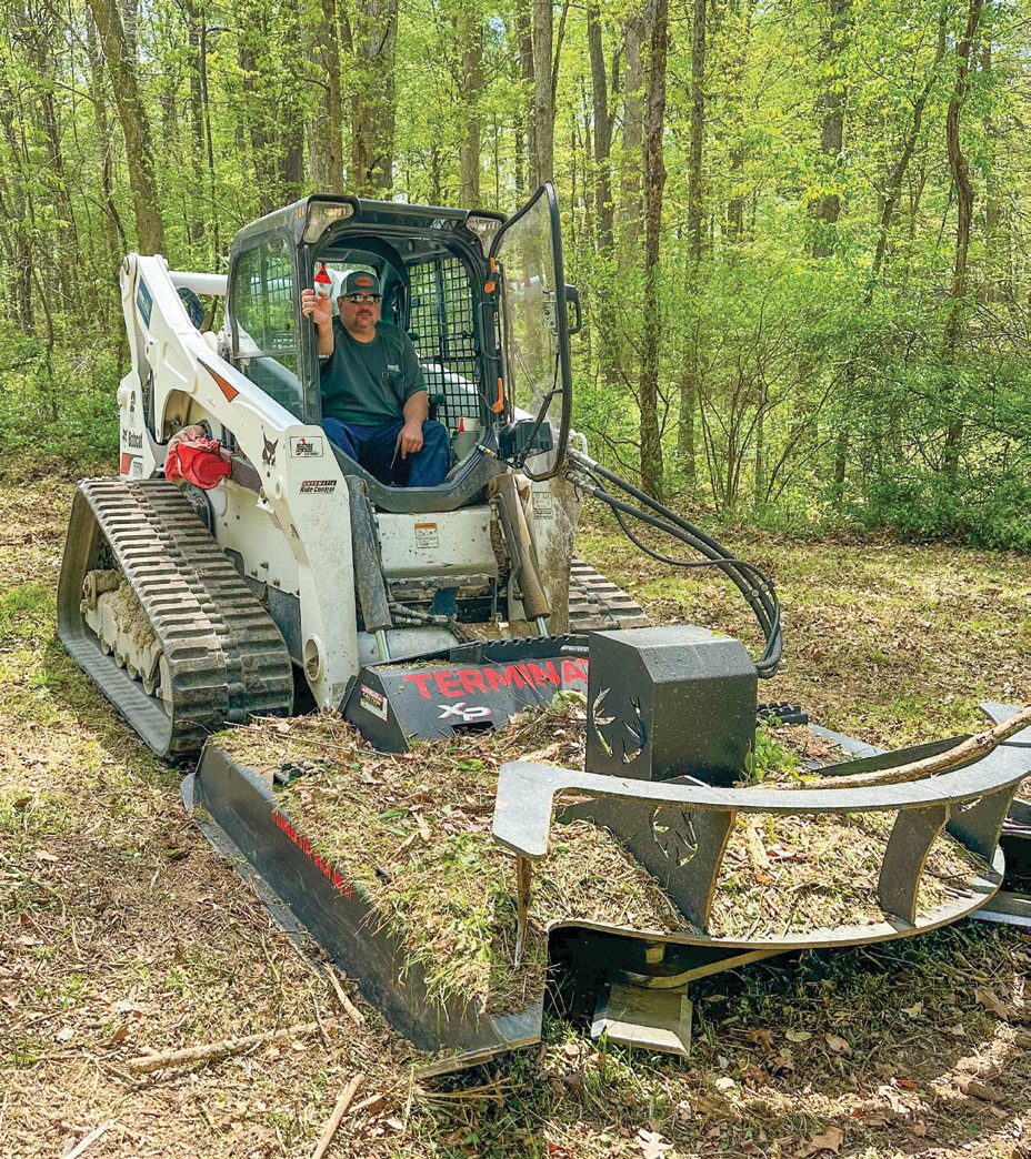 Right-of-way Foreman Kurtis Gregory mows and clears areas on a property in Osgood, Indiana to eliminate overgrown vegetation and ensure service reliability.