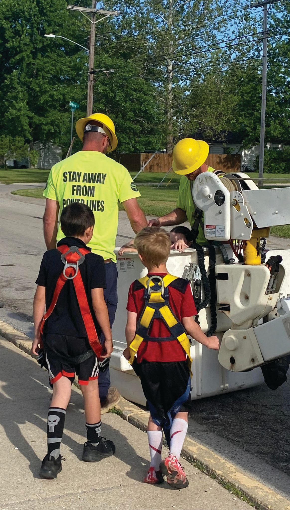 Students get ready for a bucket truck ride.