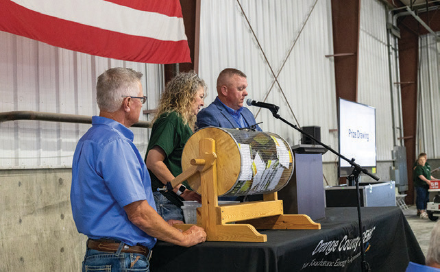 Randy Roberts, Marcy Bennett and Matt Deaton conduct the prize drawings.