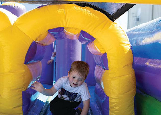 The bounce houses were a hub of fast-paced activity for the younger members.