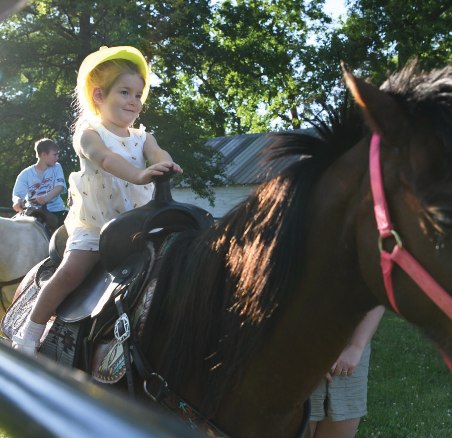 Youngsters enjoyed taking their turn around the ring at the horse and pony rides provided by Noble County Horse and Pony Club.