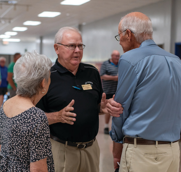 Jay County REMC Director Steve Ritchie speaks with some members. Ritchie retired after 31 years serving the membership.