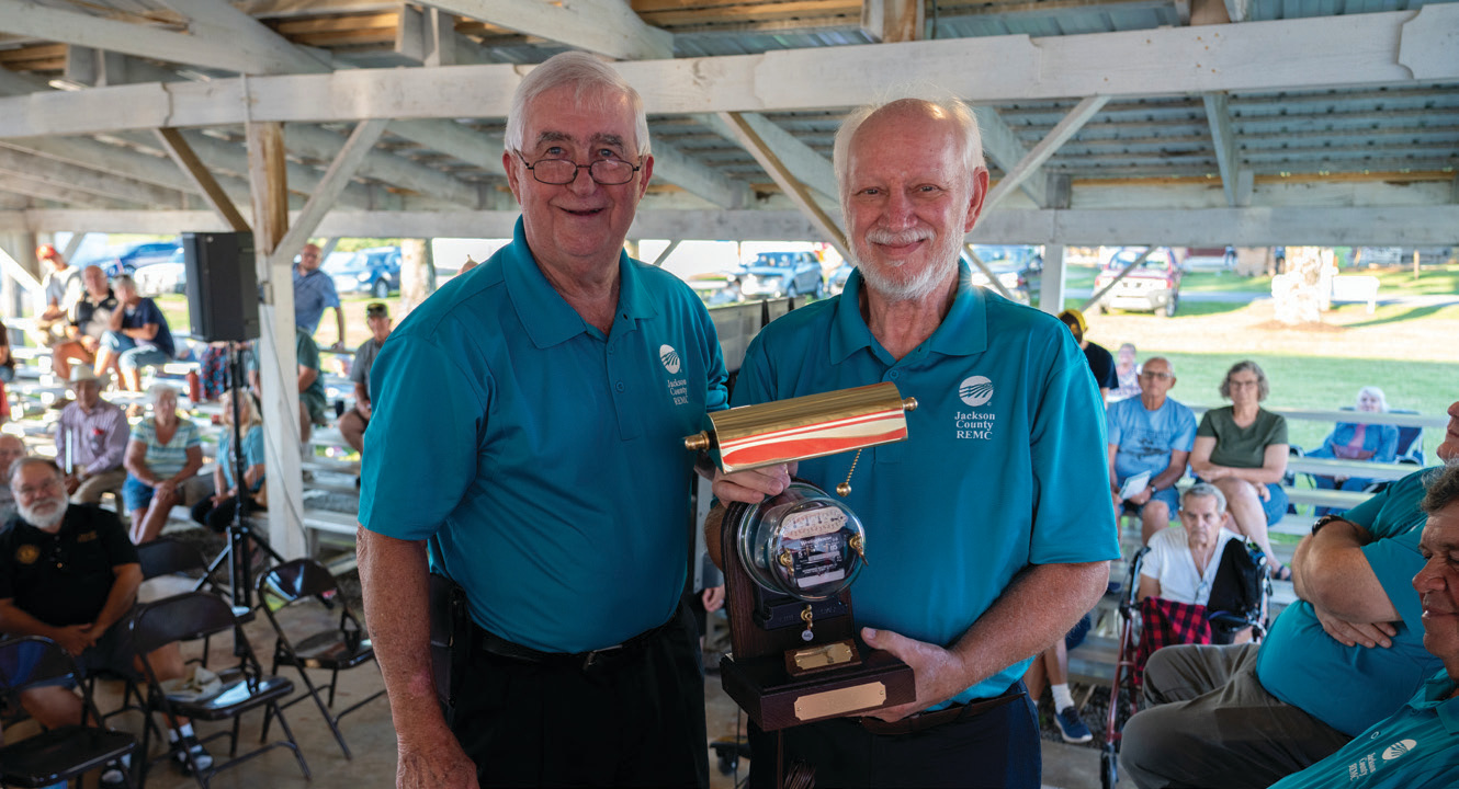 Jerry Kelley, right, receives a retirement gift from John Trinkle, President of the Board.