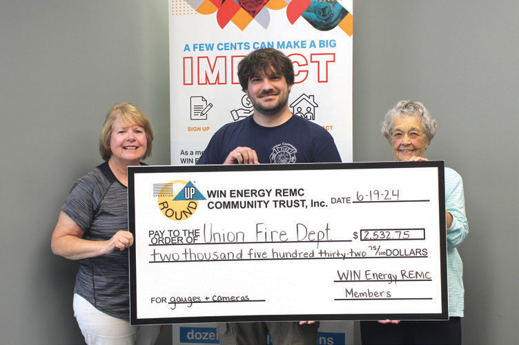 Pictured from left to right: Sydney Russler, community trust board member; Jesse Akers, chief; and Peg Callis, community trust board member