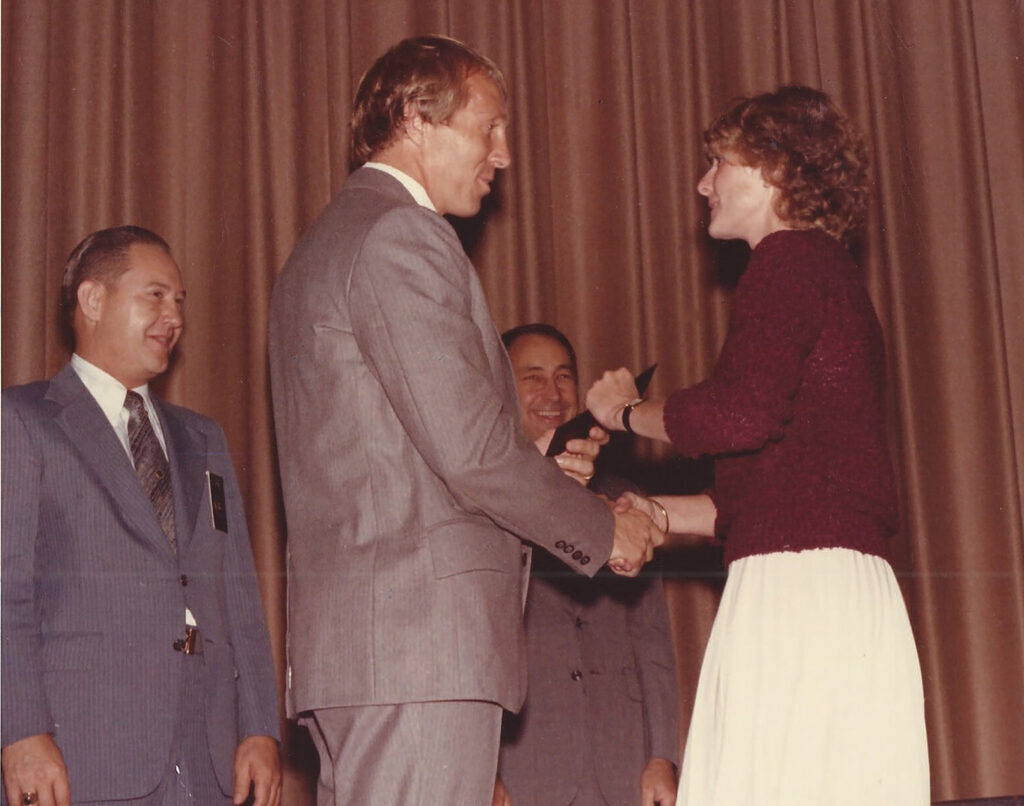 Smith receives her FBI credentials from her husband, Tom, who was an agent himself. 