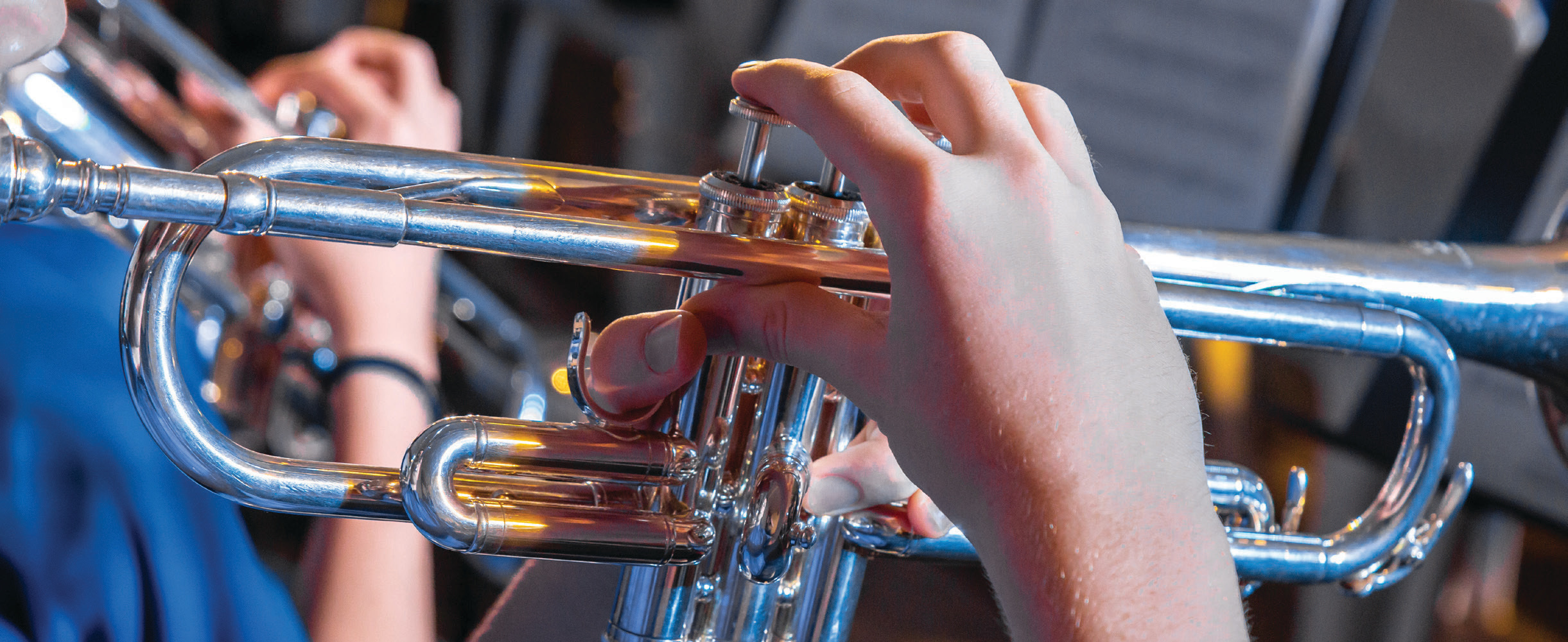 Kid playing trumpet