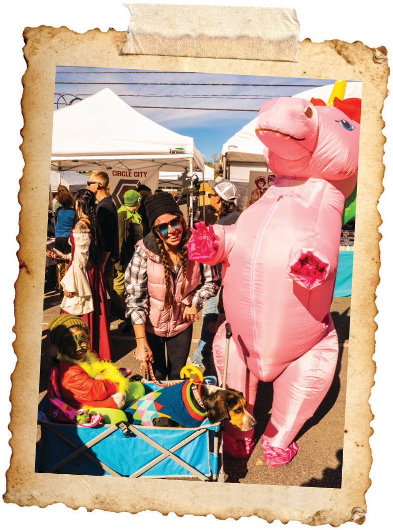 Woman posing with dog at Irvington Halloween Festival