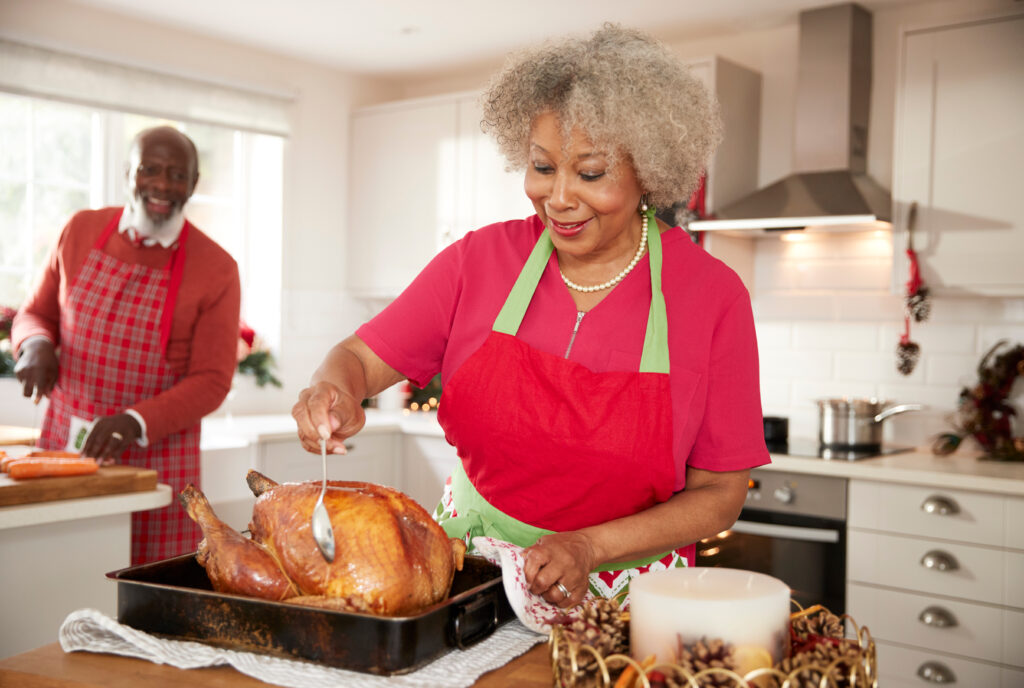 Woman cooking a turkey