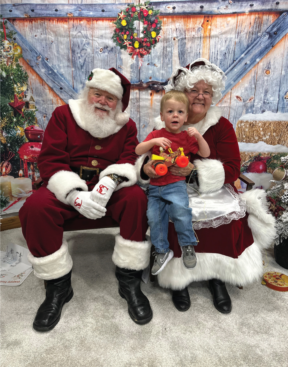 Logan Bohnert, son of Blake and Chelsey Bohnert, visits with Santa at Harrison REMC.